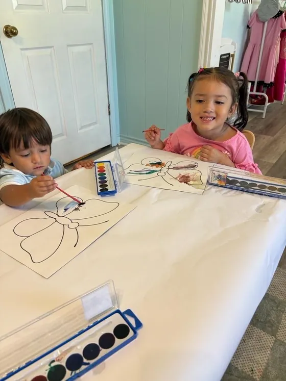 Children painting with watercolors at Bright Haven