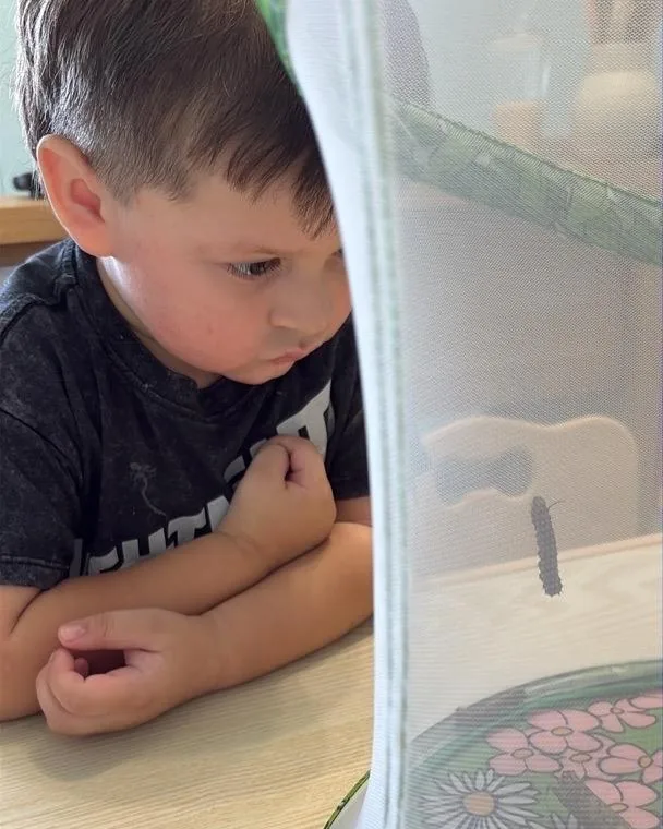 A Pre-K child painting at Bright Haven
